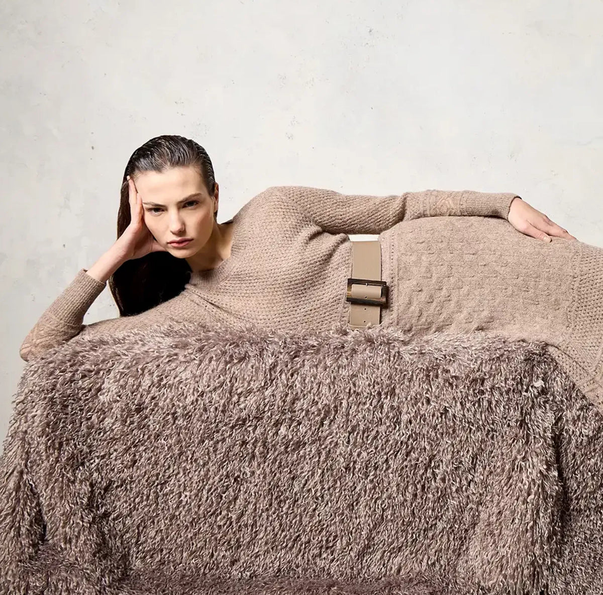 Model wearing a knitted dress and belt by D-Exterior, Fall Winter 2026 collection